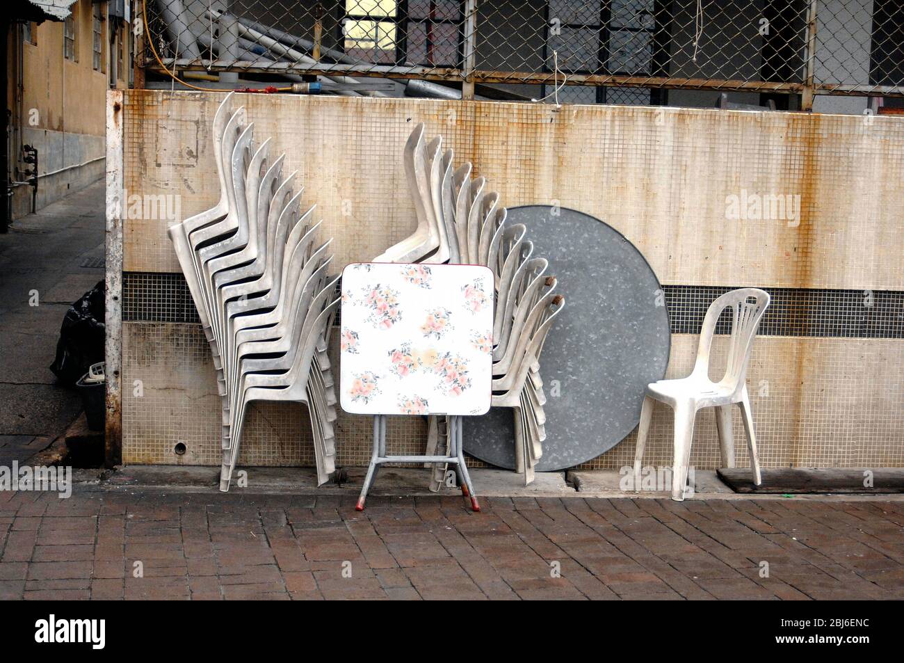 Sidewalk restaurant furniture, stacked, Hong Kong Stock Photo Alamy
