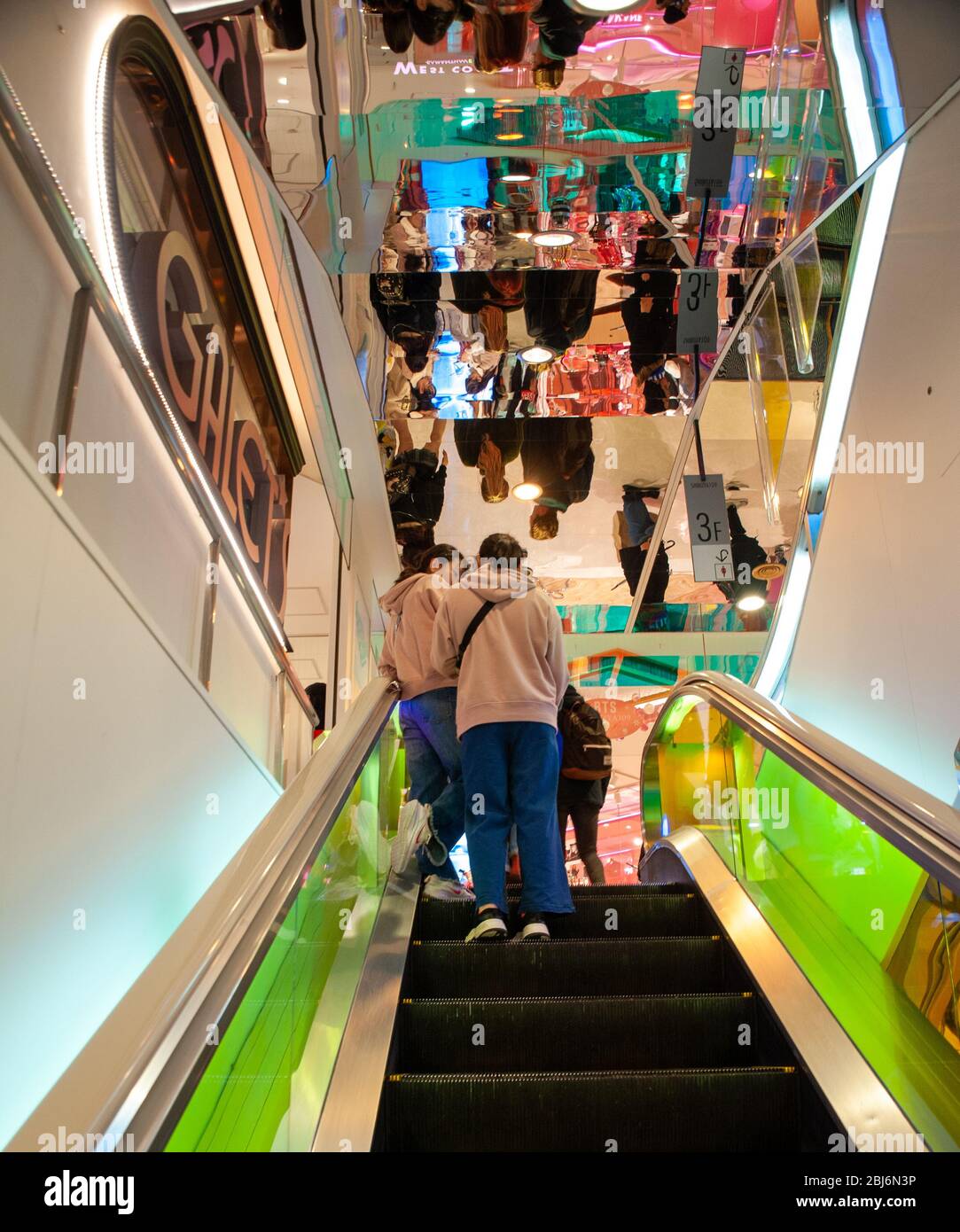 shoppers use the escalators inside 109 department store building, at the heart of Shibuya center in Tokyo, Japan Stock Photo