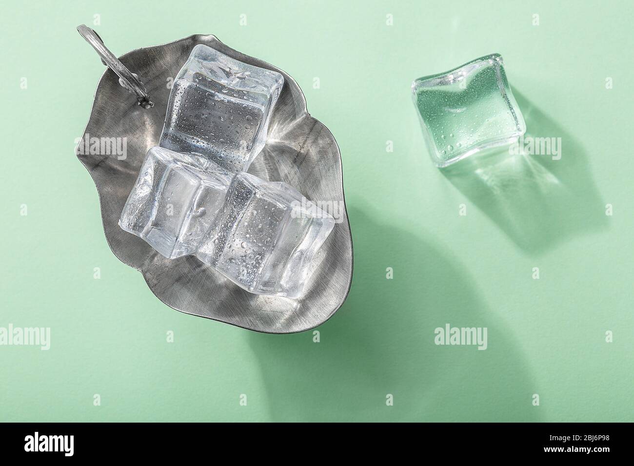 Colored banner with fresh ice cubes and reflections Stock Photo