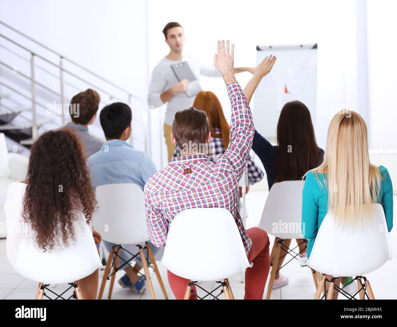 Woman raising hand volunteer hi-res stock photography and images - Alamy