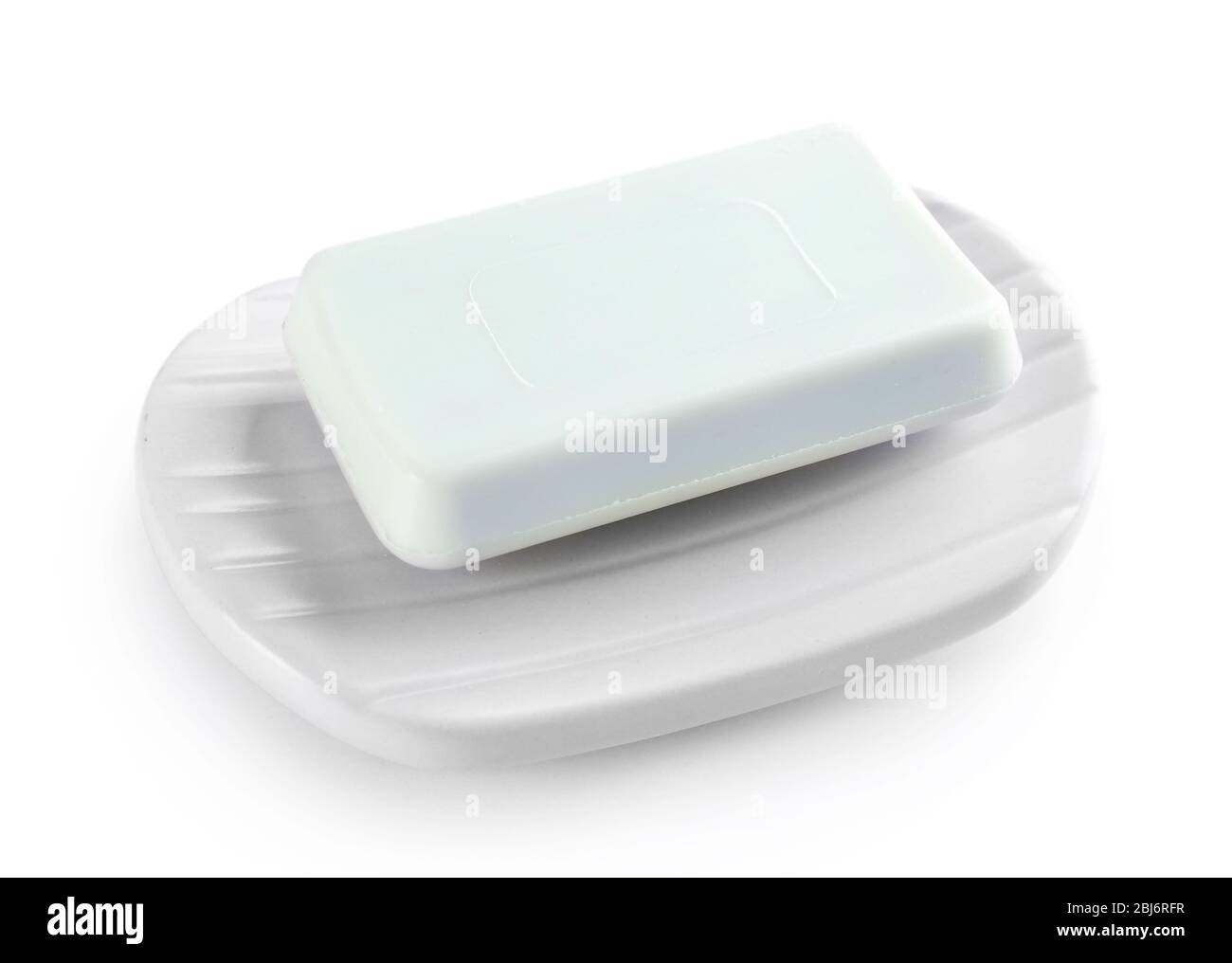 Soap on a dish, isolated on white Stock Photo - Alamy