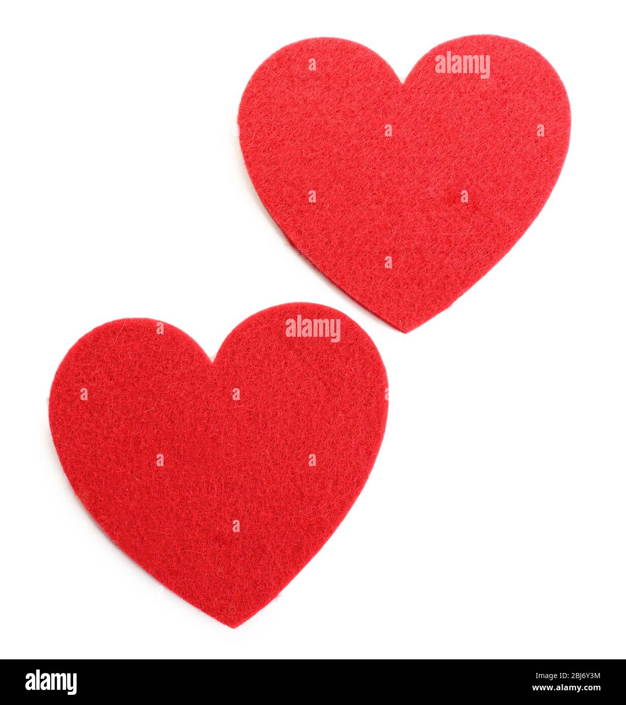 Red felt hearts isolated on white background Stock Photo - Alamy