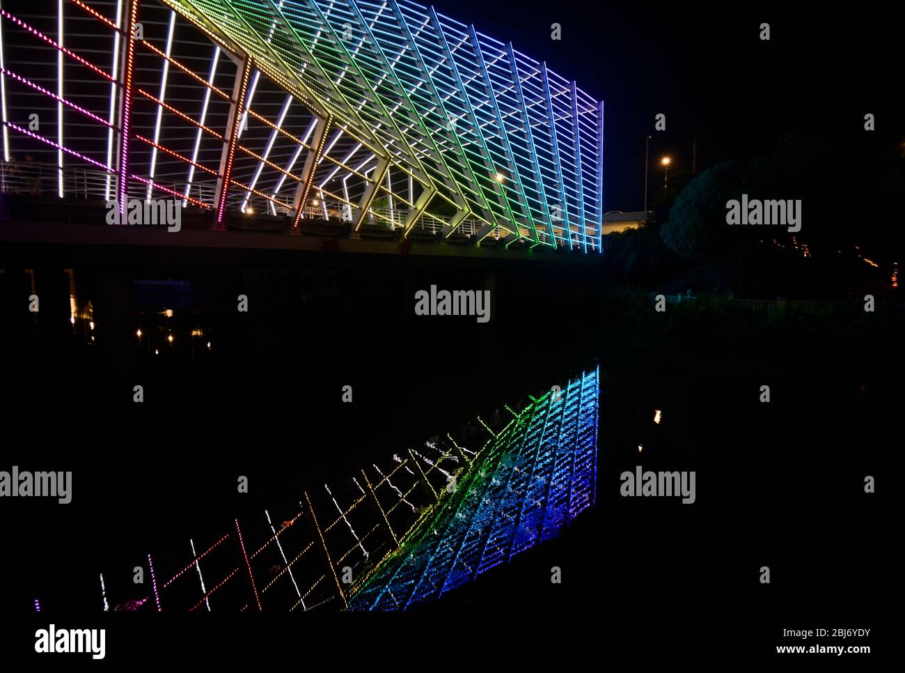 Rainbow neon lights coloured bridge over the Chu River, at the end of Han Street, Wuhan, China Stock Photo