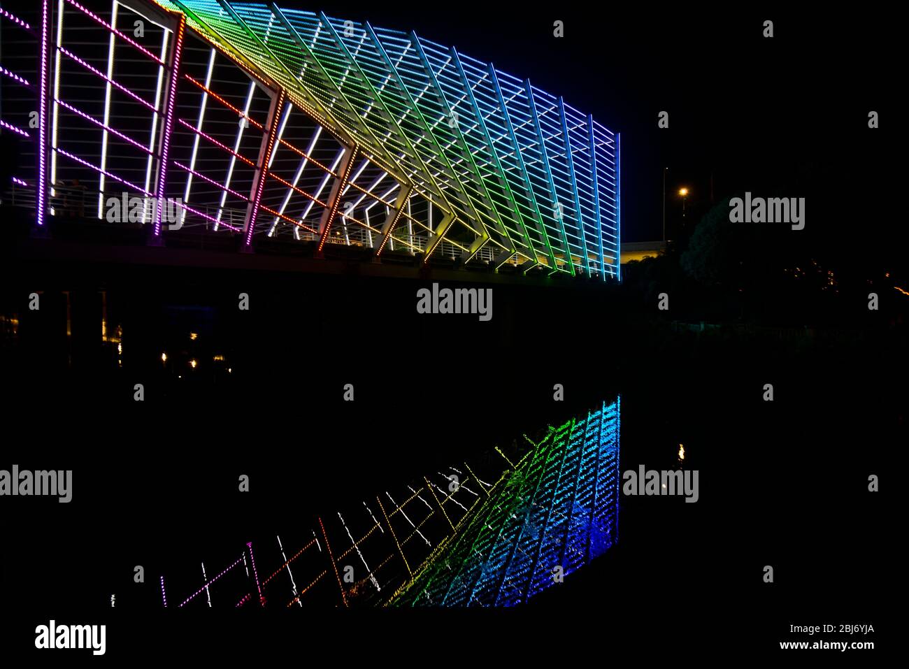 Rainbow neon lights coloured bridge over the Chu River, at the end of Han Street, Wuhan, China Stock Photo