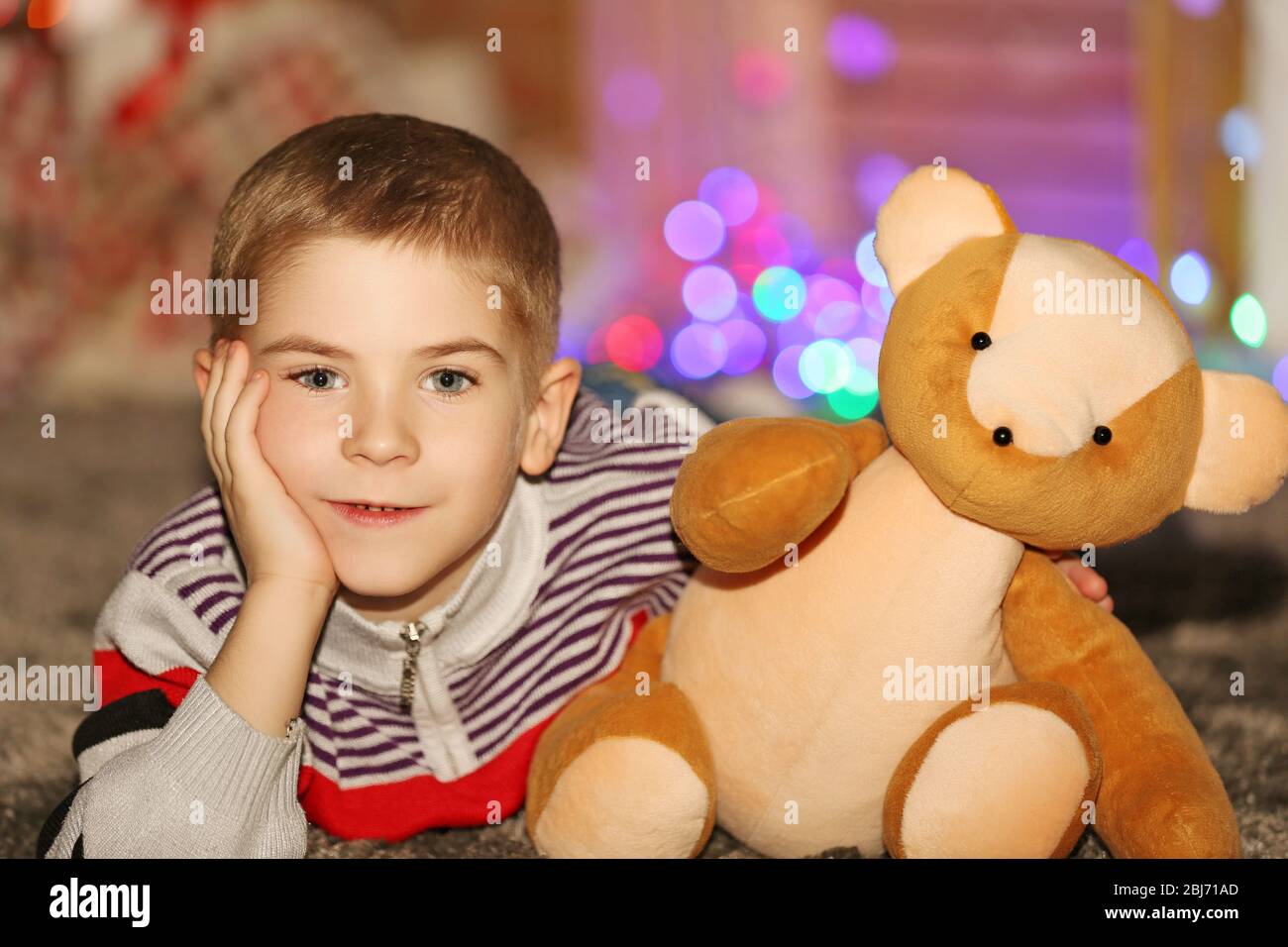 Portrait of little boy with Teddy bear on a blurred background Stock ...