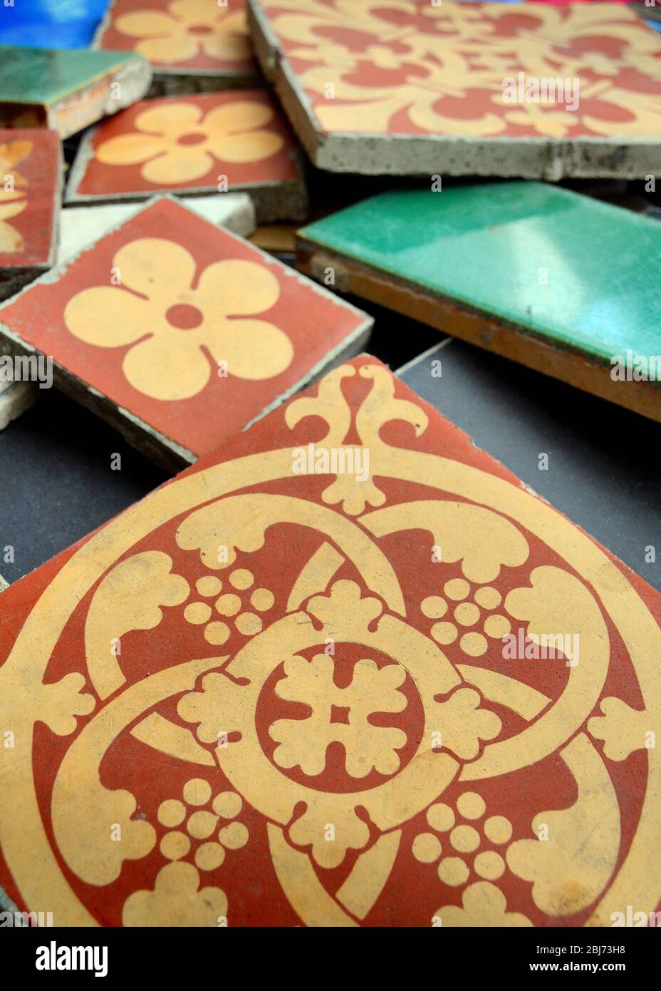 Variety of types and sizes of  Victorian floor ceramic tiles including some manufactured by Minton and co, stoke on trent, Stock Photo