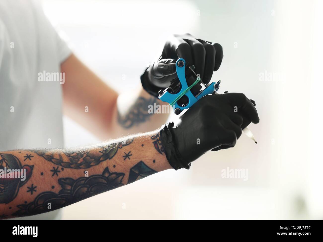 Person holding black tattoo machine Tattoo machine Tattoo ink Tattoo  artist Therapy Ink machine gun ink outdoor Shoe machine Gun png   PNGWing