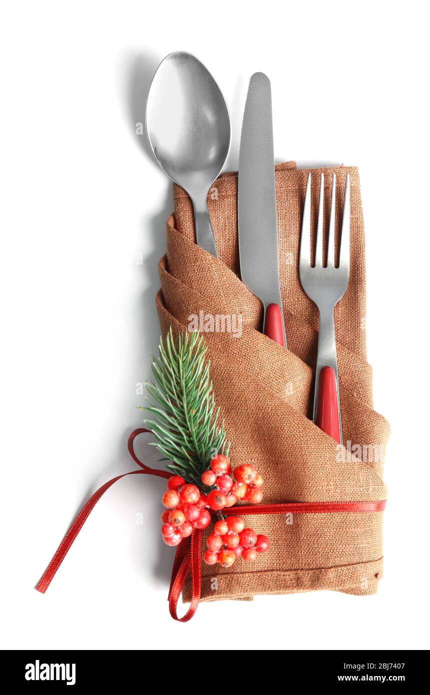Christmas serving cutlery in a napkin, isolated on white Stock Photo