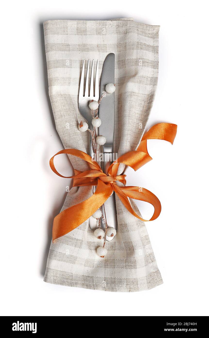 Christmas serving cutlery in a napkin, isolated on white Stock Photo
