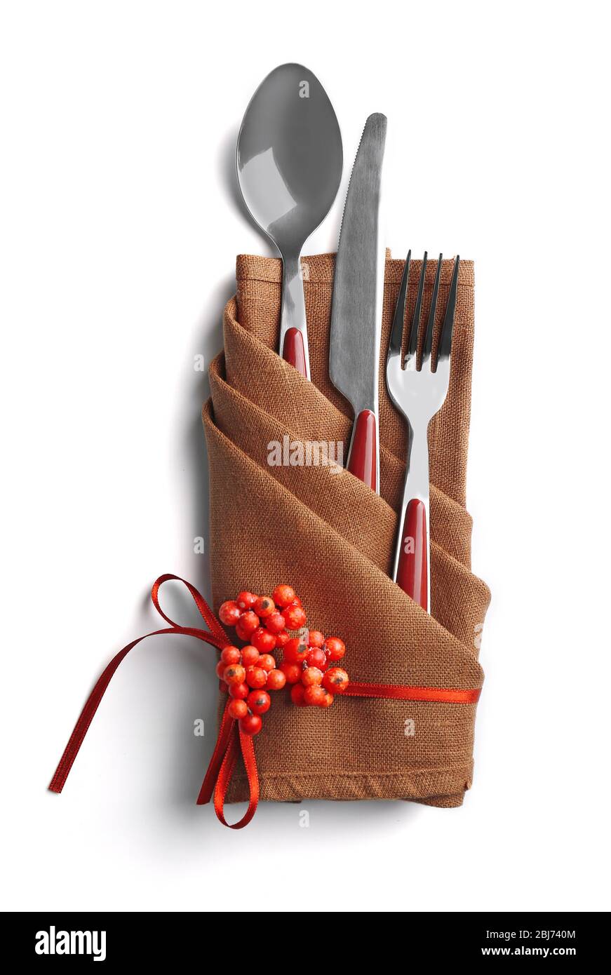 Christmas serving cutlery in a napkin, isolated on white Stock Photo