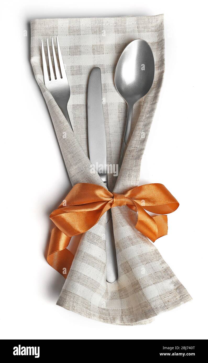 Christmas serving cutlery in a napkin, isolated on white Stock Photo
