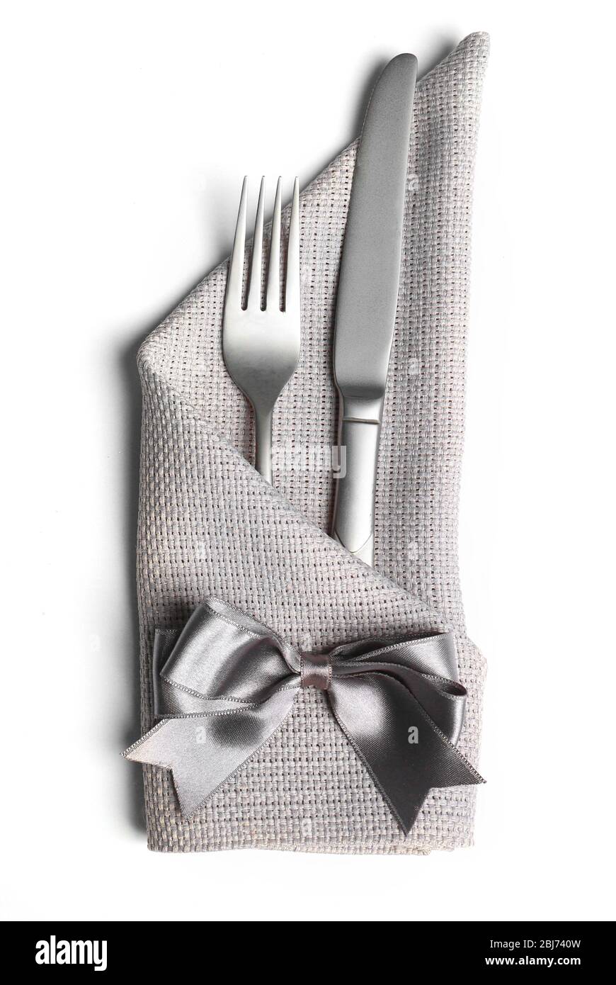 Christmas serving cutlery in a napkin, isolated on white Stock Photo