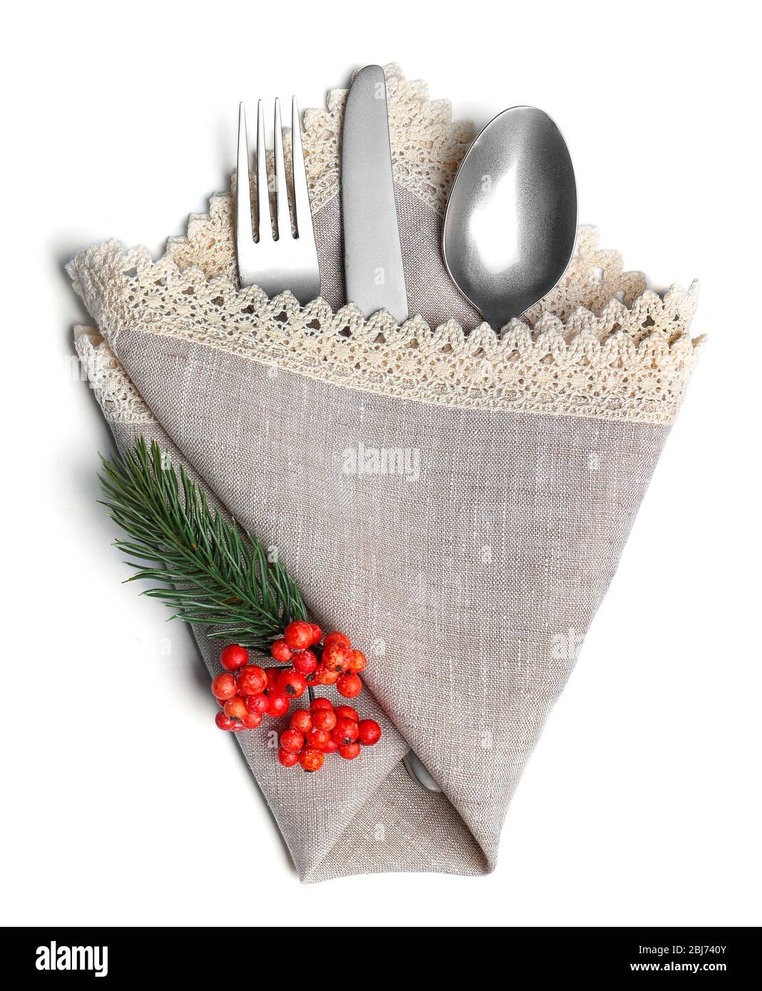 Christmas serving cutlery in a napkin, isolated on white Stock Photo