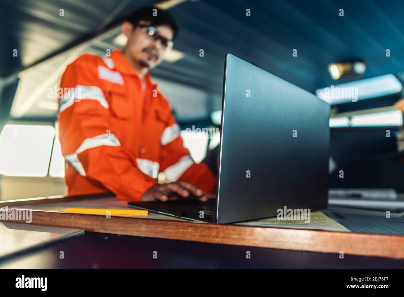 Using laptop ship bridge hi-res stock photography and images - Alamy
