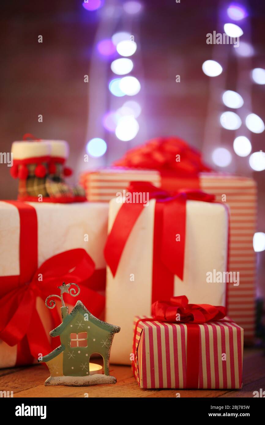 Christmas gift boxes and lights on the wooden table Stock Photo - Alamy