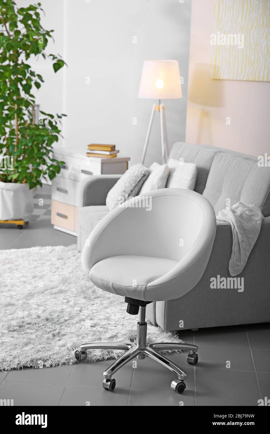 Living room design with armchair and sofa Stock Photo - Alamy