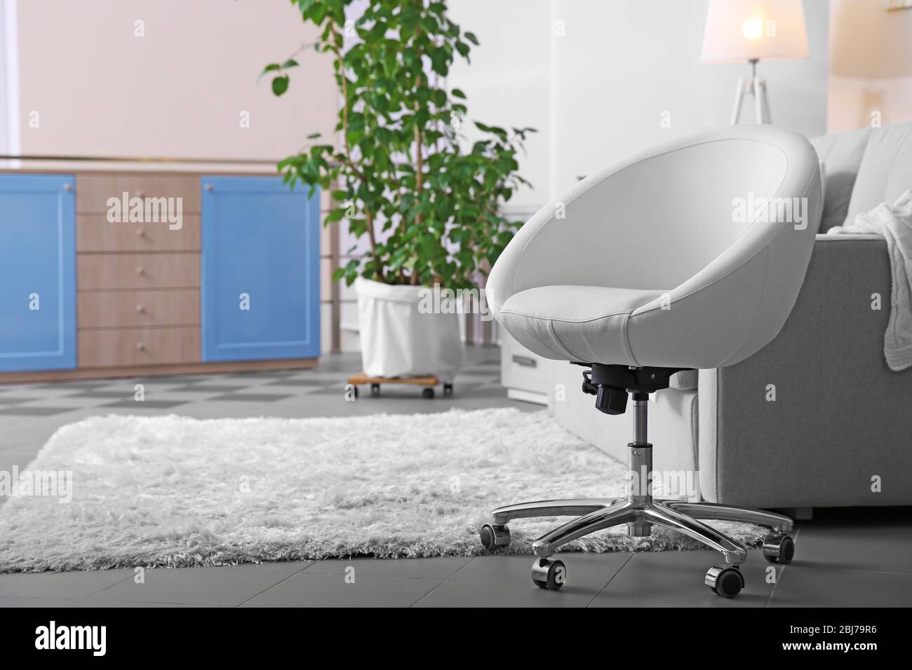 Living room design with armchair and sofa Stock Photo - Alamy