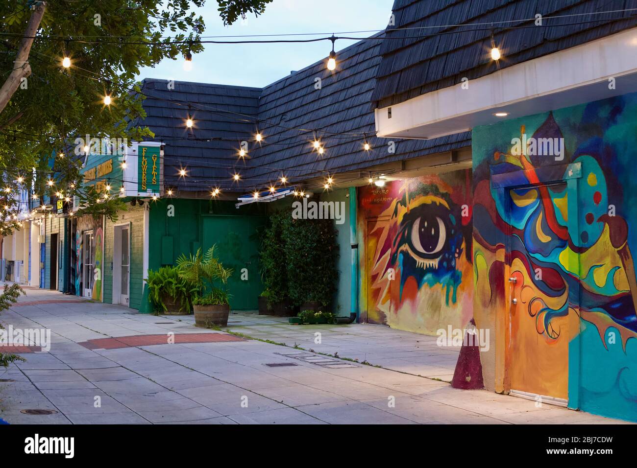 Artist alley with mural paintings and bistro lights in Oceanside, California Stock Photo