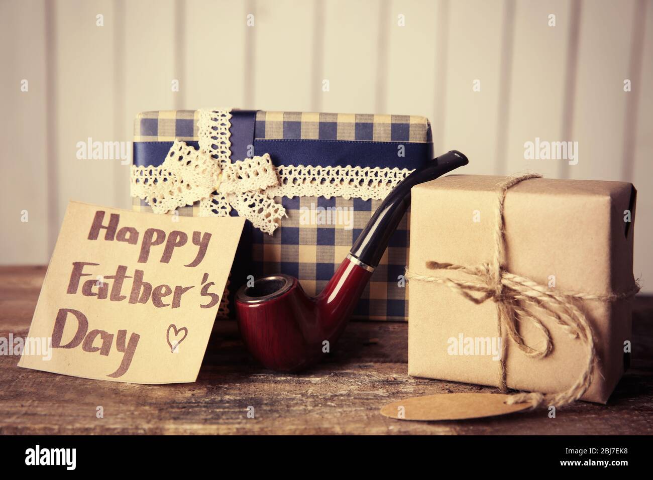 Greeting card for Happy Father's Day with gift boxes and pipe on ...