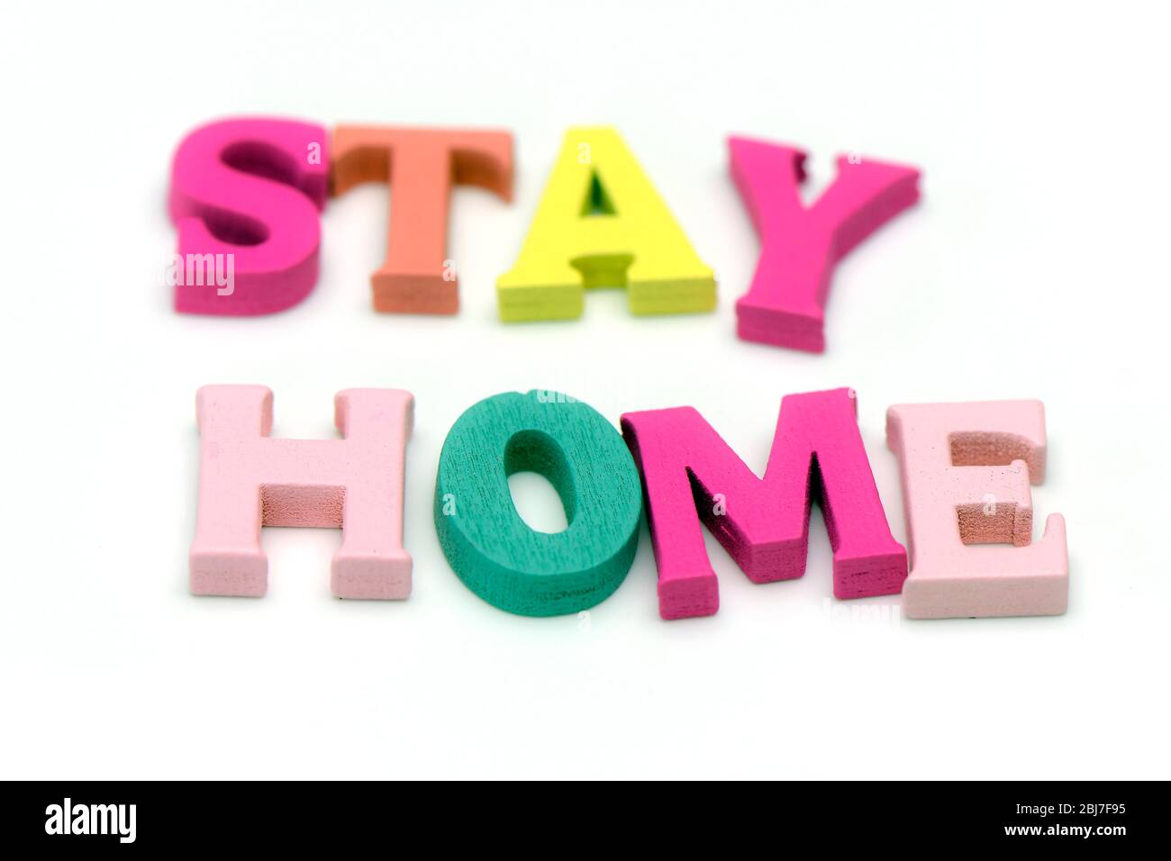 Pastel words STAY HOME on white background for avoid COVID19 infection