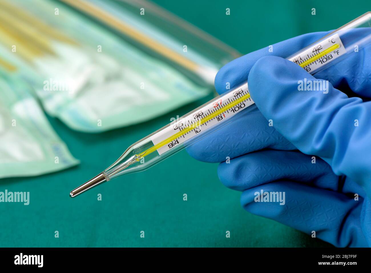 Oral Thermometer And The Medical Staff S Hand Body