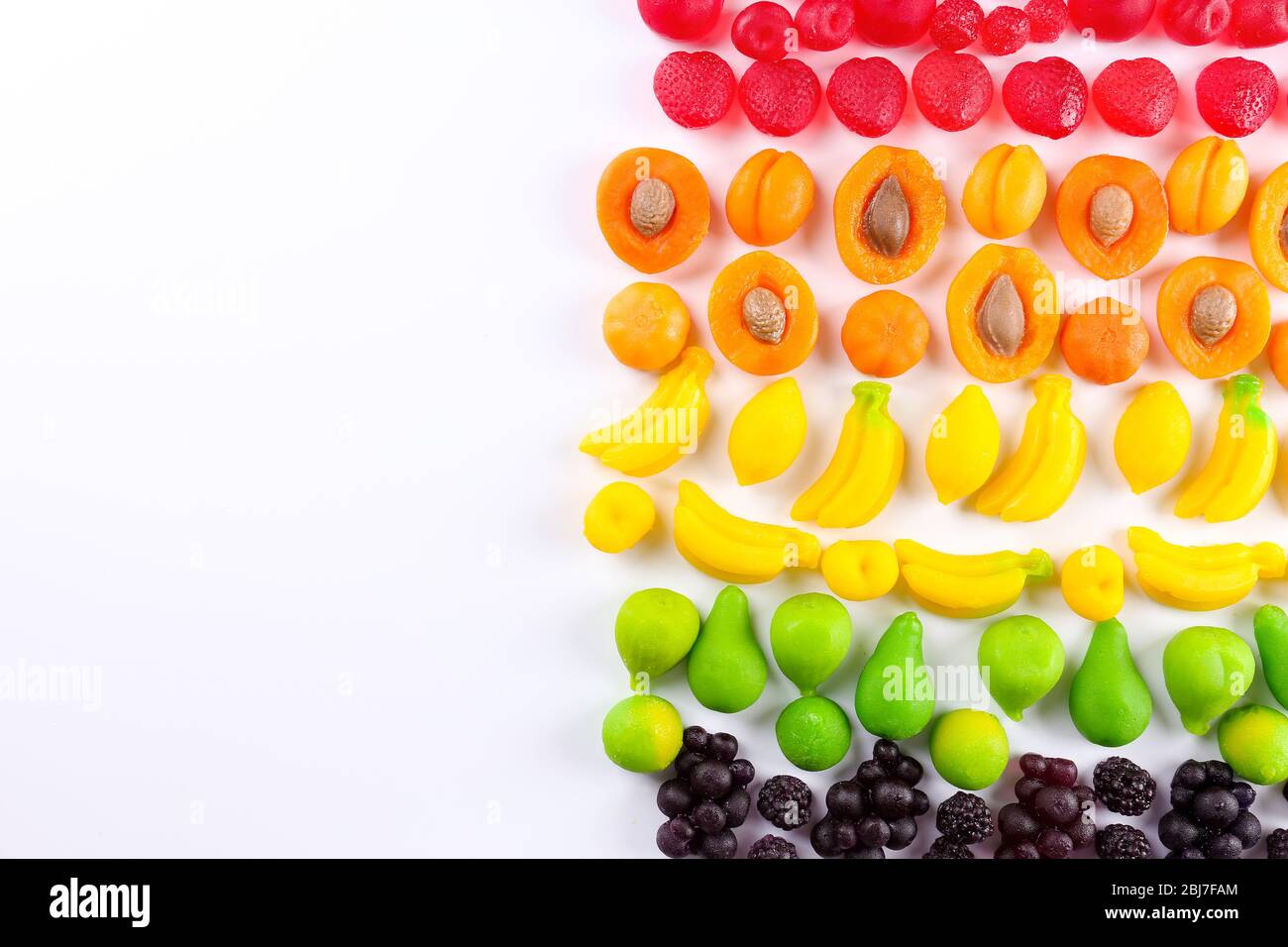 Fruit candies isolated on white Stock Photo - Alamy