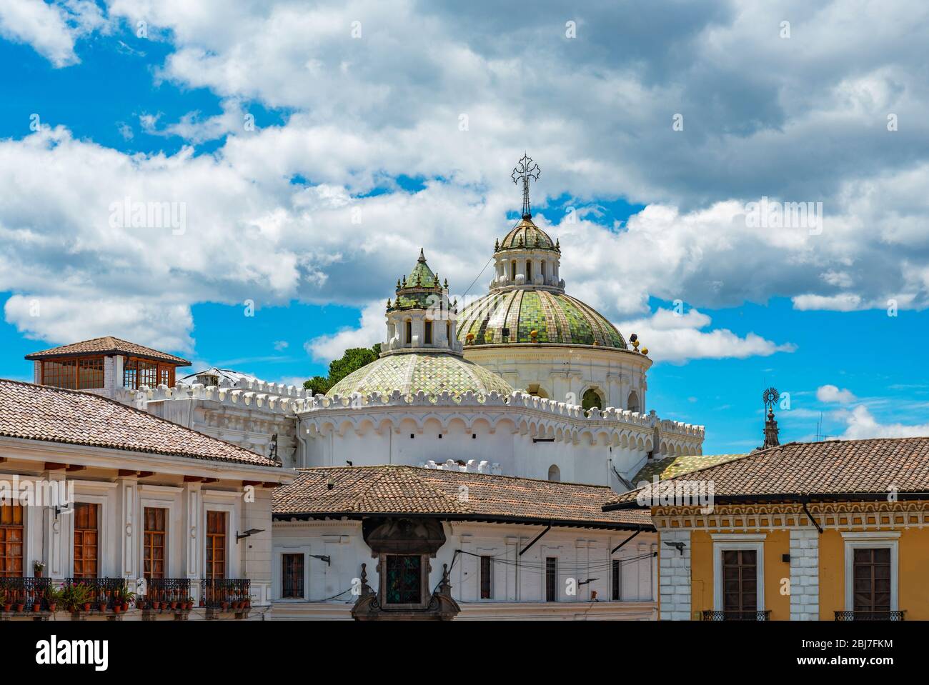 The domes of the Jesuit Compania de Jesus church and colonial style facades in the historic city center of Quito, Ecuador. Stock Photo