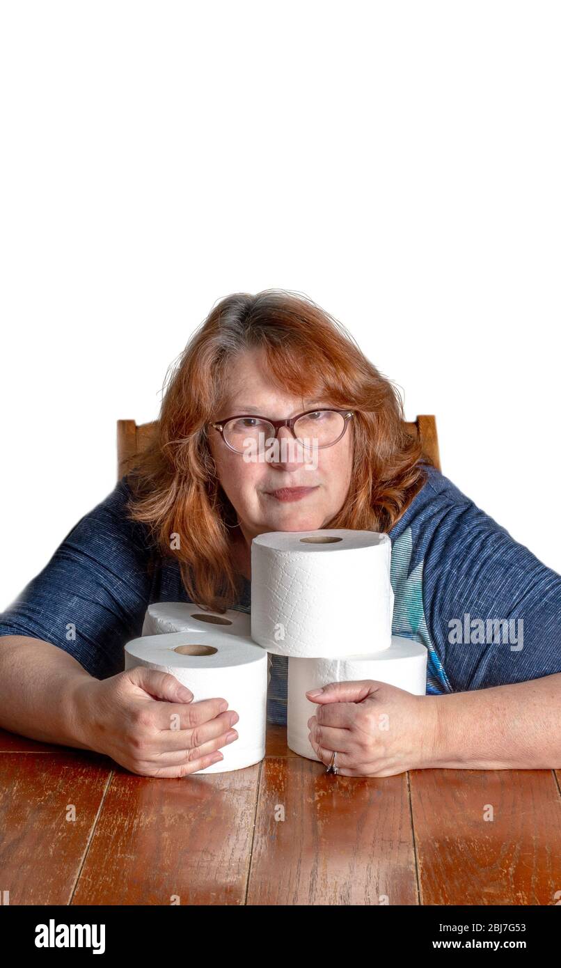 A woman hugs her stash of toilet paper rolls as the world goes crazy