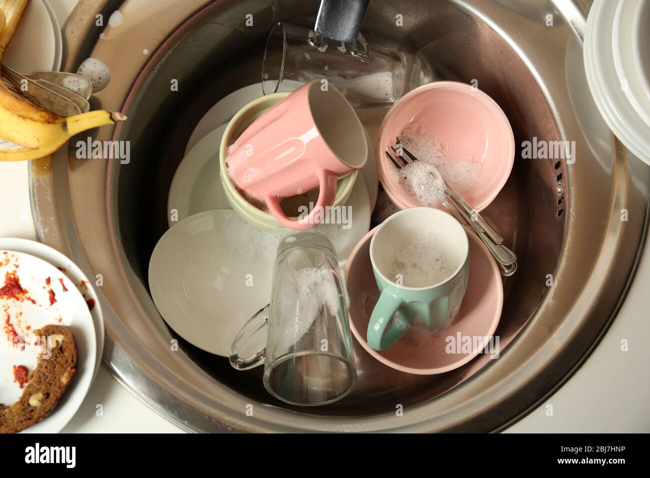 Dirty dishes in kitchen sink closeup Stock Photo