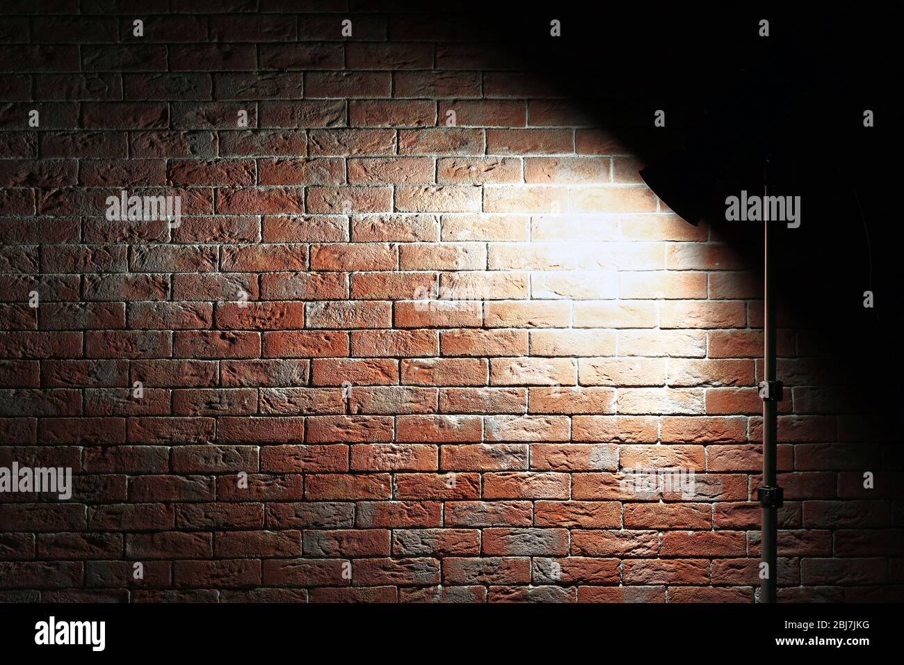 Studio light on brick Stock Photo Alamy