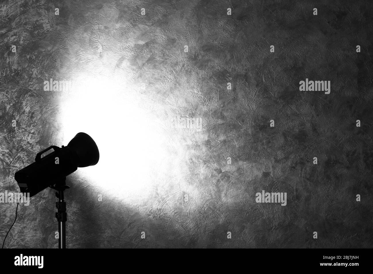 Studio light flash on wall grey textured background Stock Photo Alamy