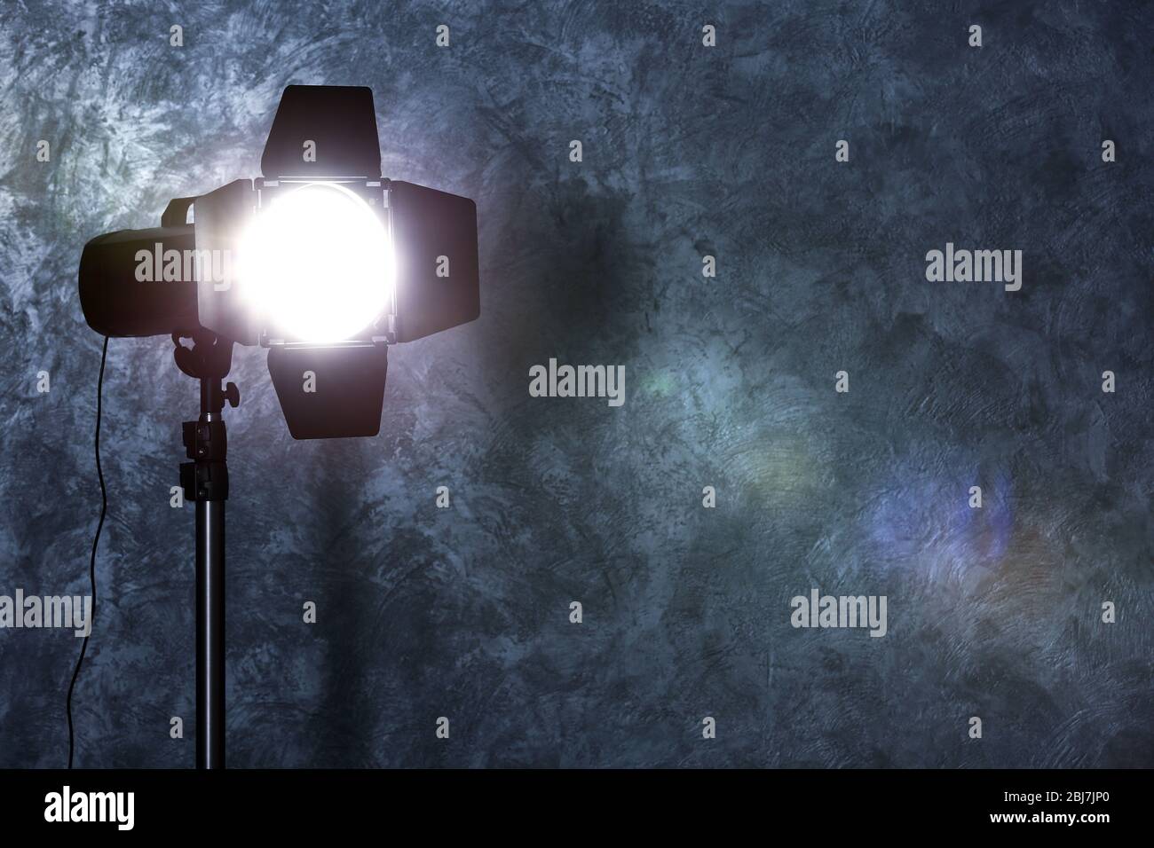 Studio light flash on wall grey textured background Stock Photo Alamy