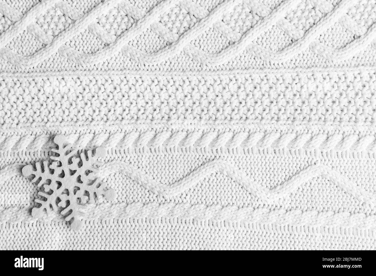 Winter background with snowflake on knitted background Stock Photo - Alamy