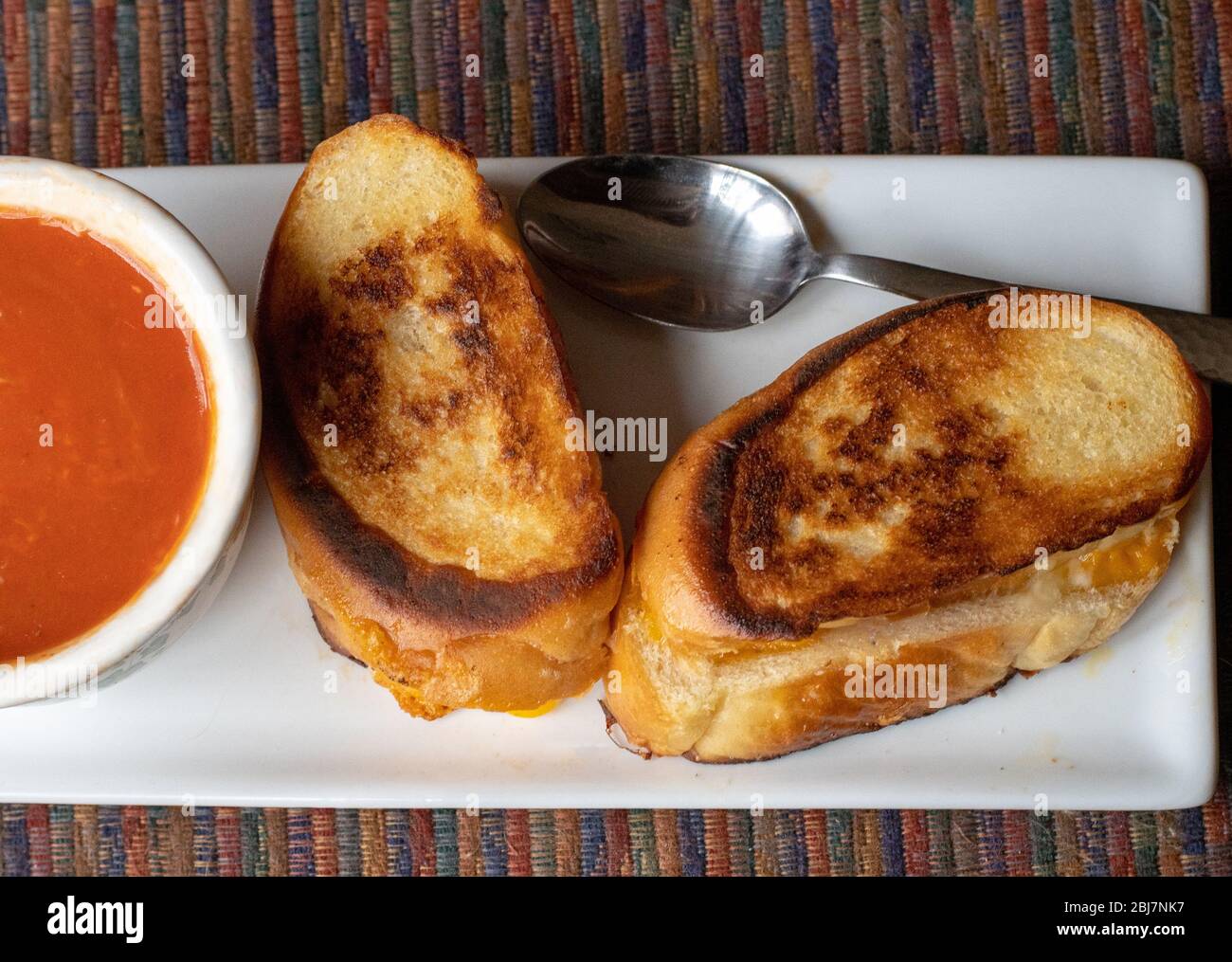 Grilled cheese sandwiches and tomato soup; easy comfort food during a pandemic Stock Photo