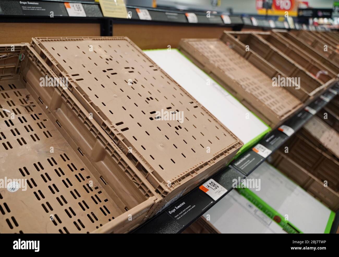 Cromwell, CT / USA - April 20, 2020: Empty crates that once held fresh produce lie empty in Walmart Stock Photo