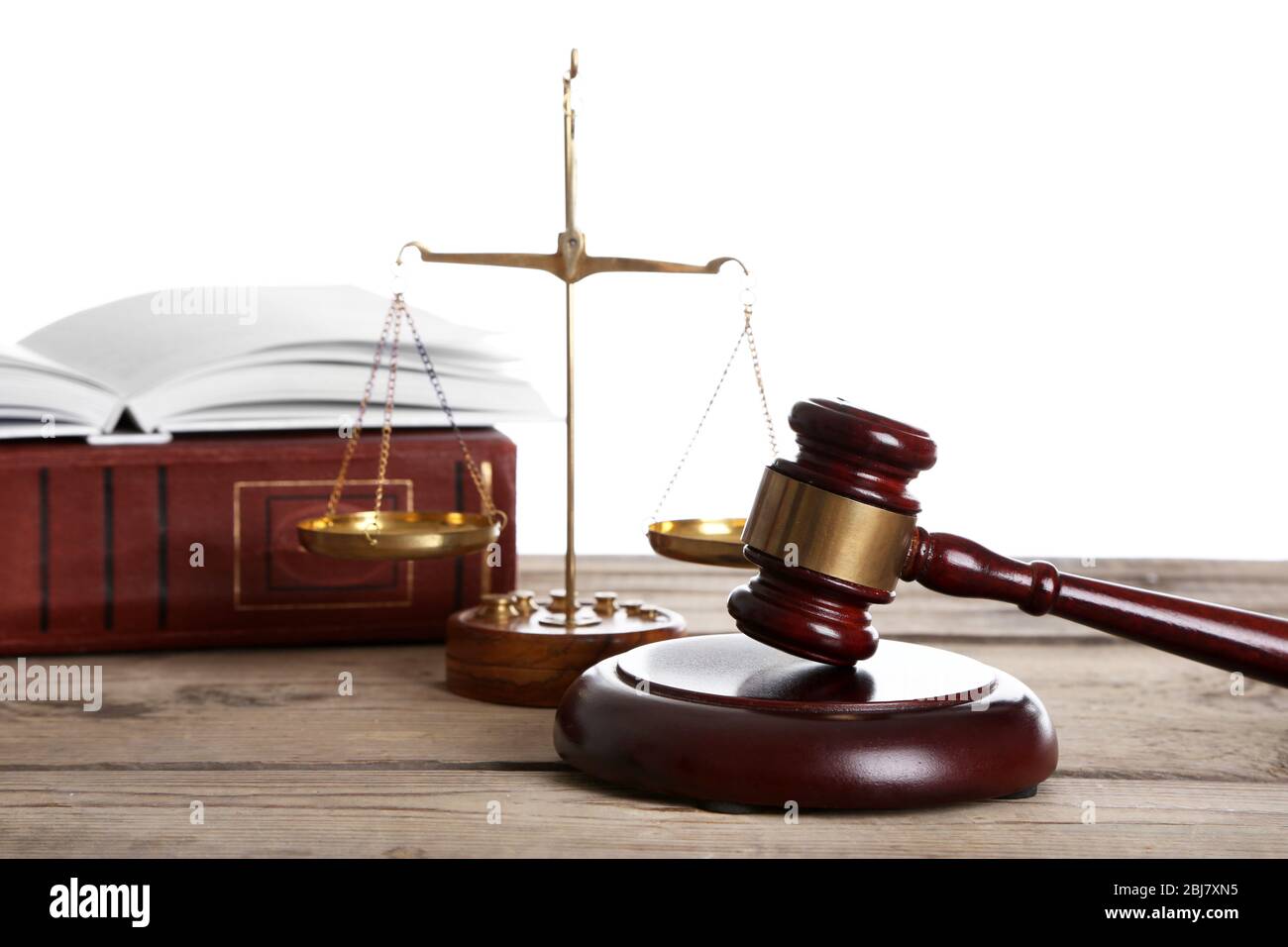 Wooden gavel with justice scales and books on white background Stock ...