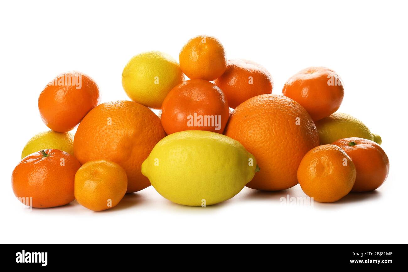 A heap of mixed citrus fruit including   lemons, tangerines, oranges isolated on a white background, close up Stock Photo