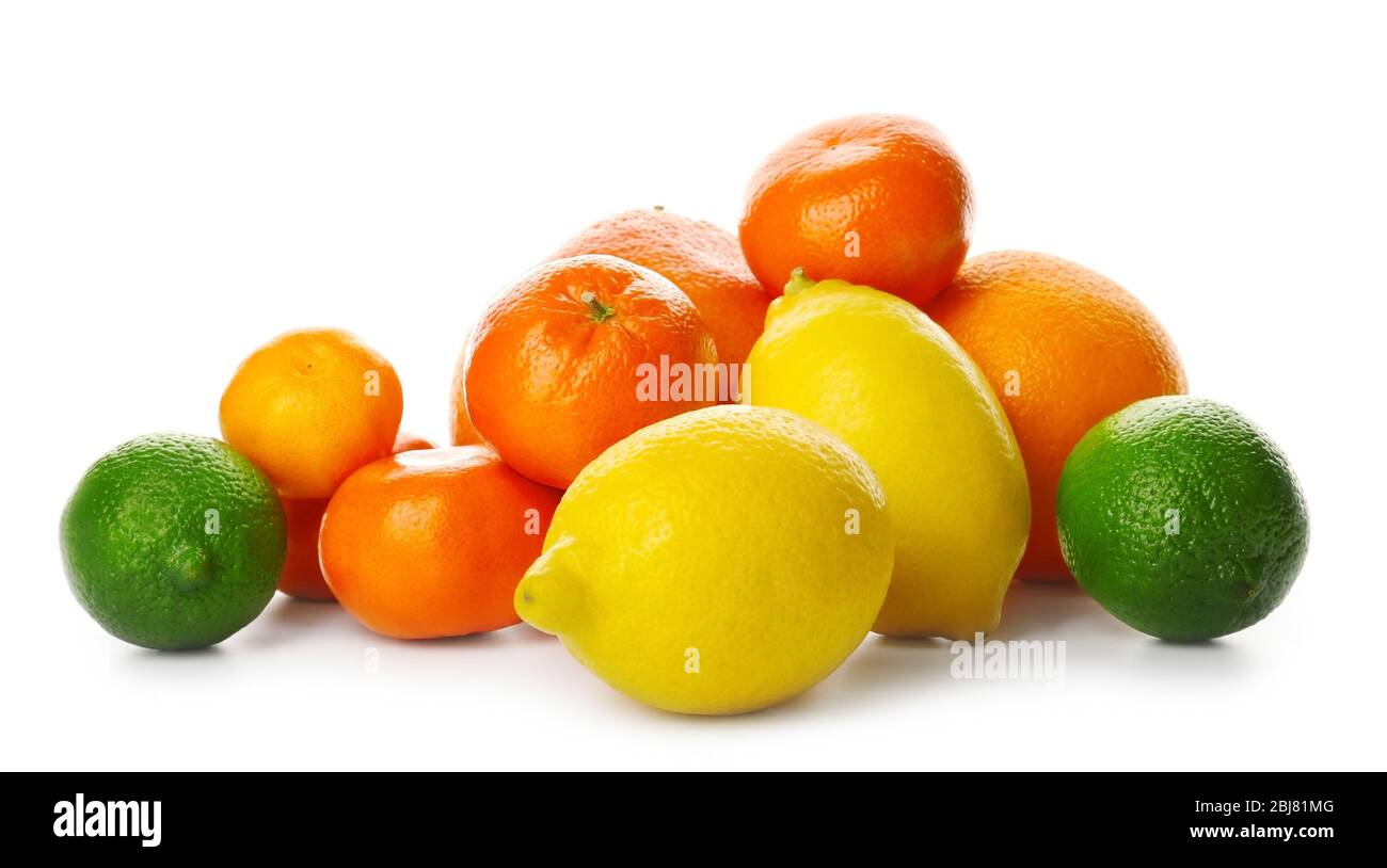 A heap of mixed citrus fruit including   lemons, limes, grapefruit, oranges and tangerines isolated on a white background, close up Stock Photo