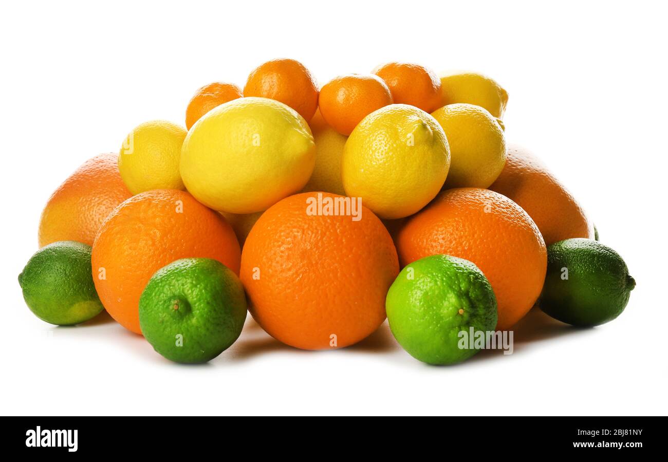 A heap of mixed citrus fruit including   lemons, limes, grapefruits, oranges and tangerines isolated on a white background, close up Stock Photo