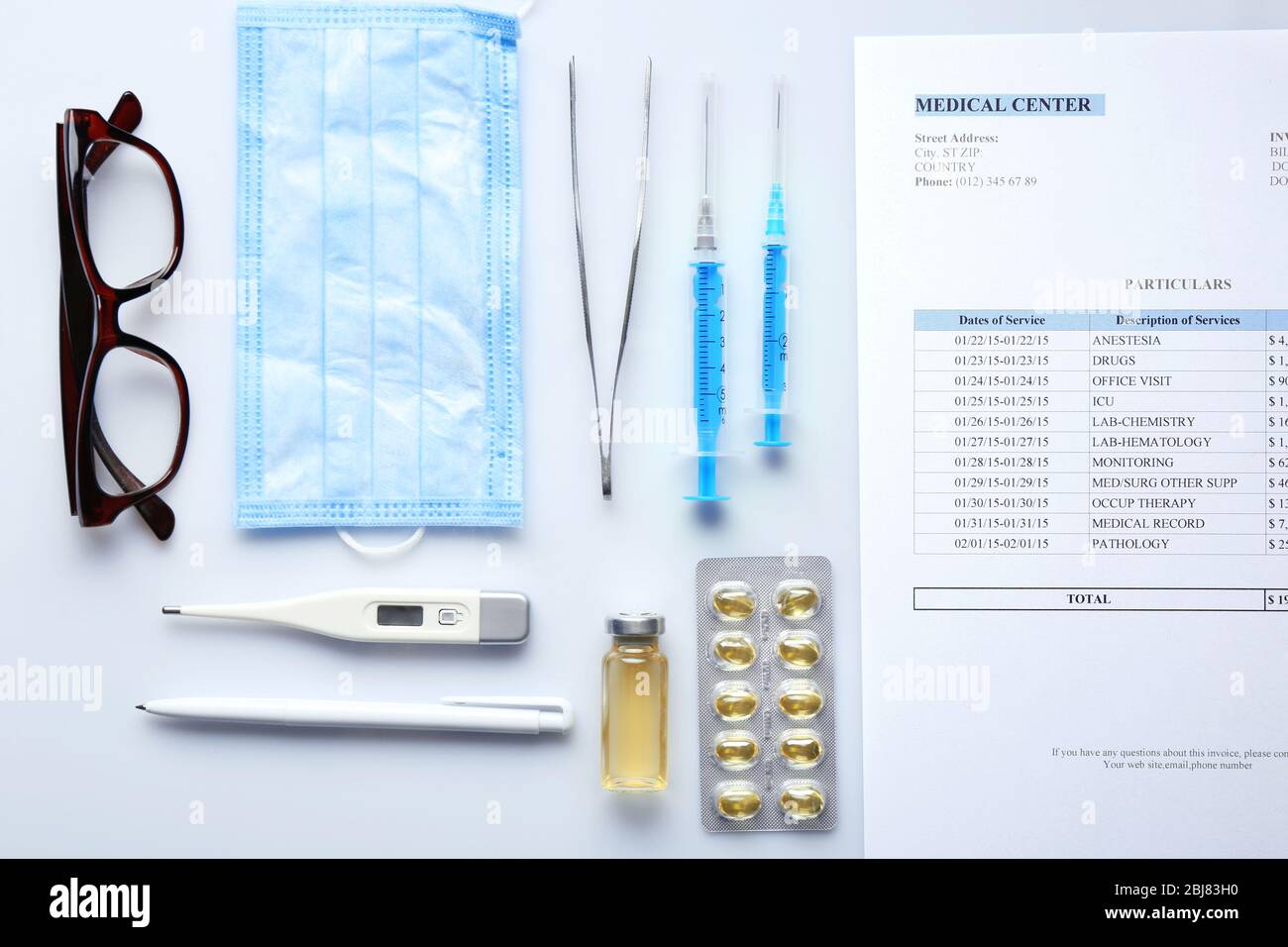 Doctor table with medicines and glasses, top view Stock Photo - Alamy