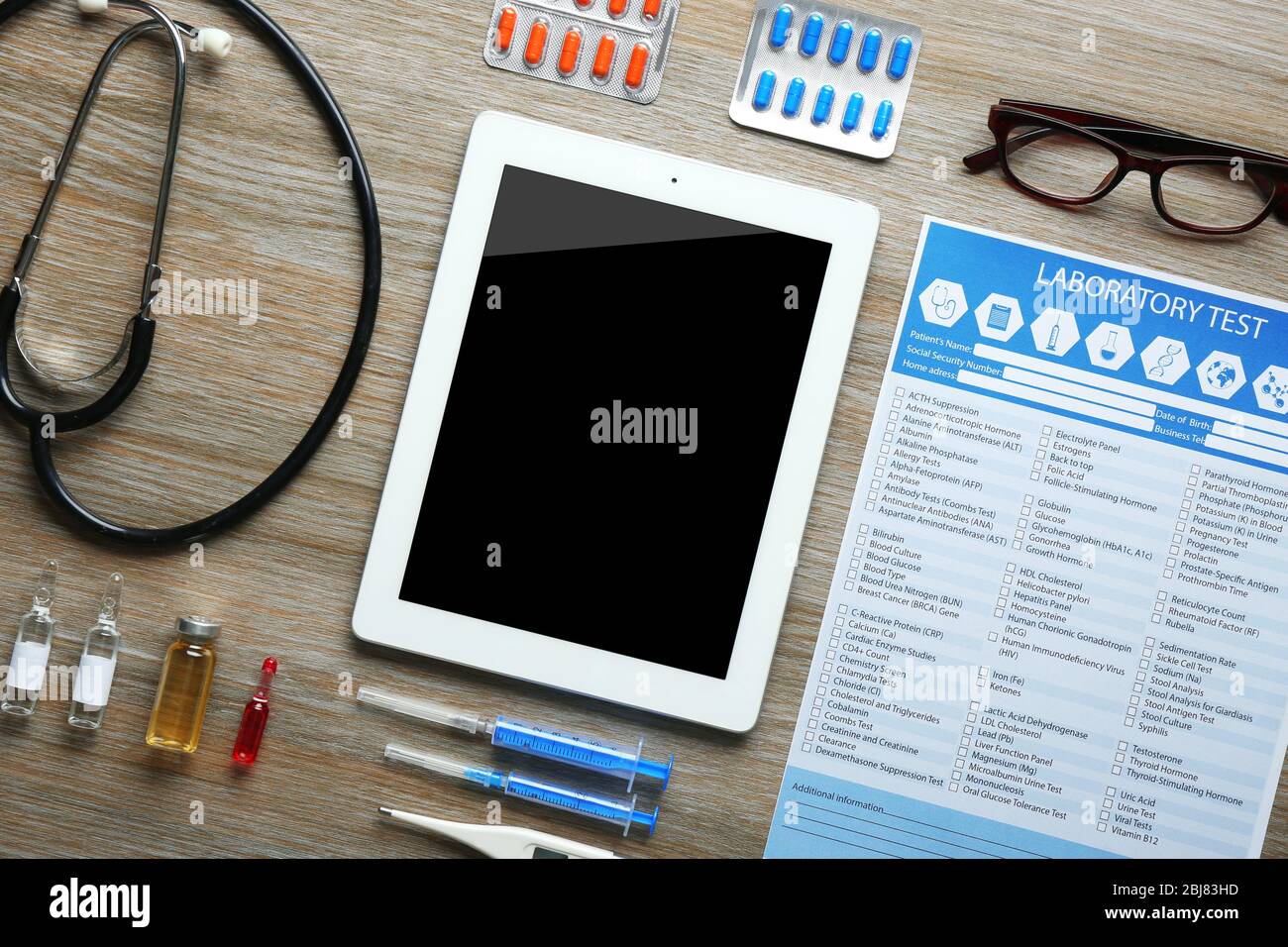 Doctor Table View Doctor table with medicines and tablet, top view Stock Photo - Alamy