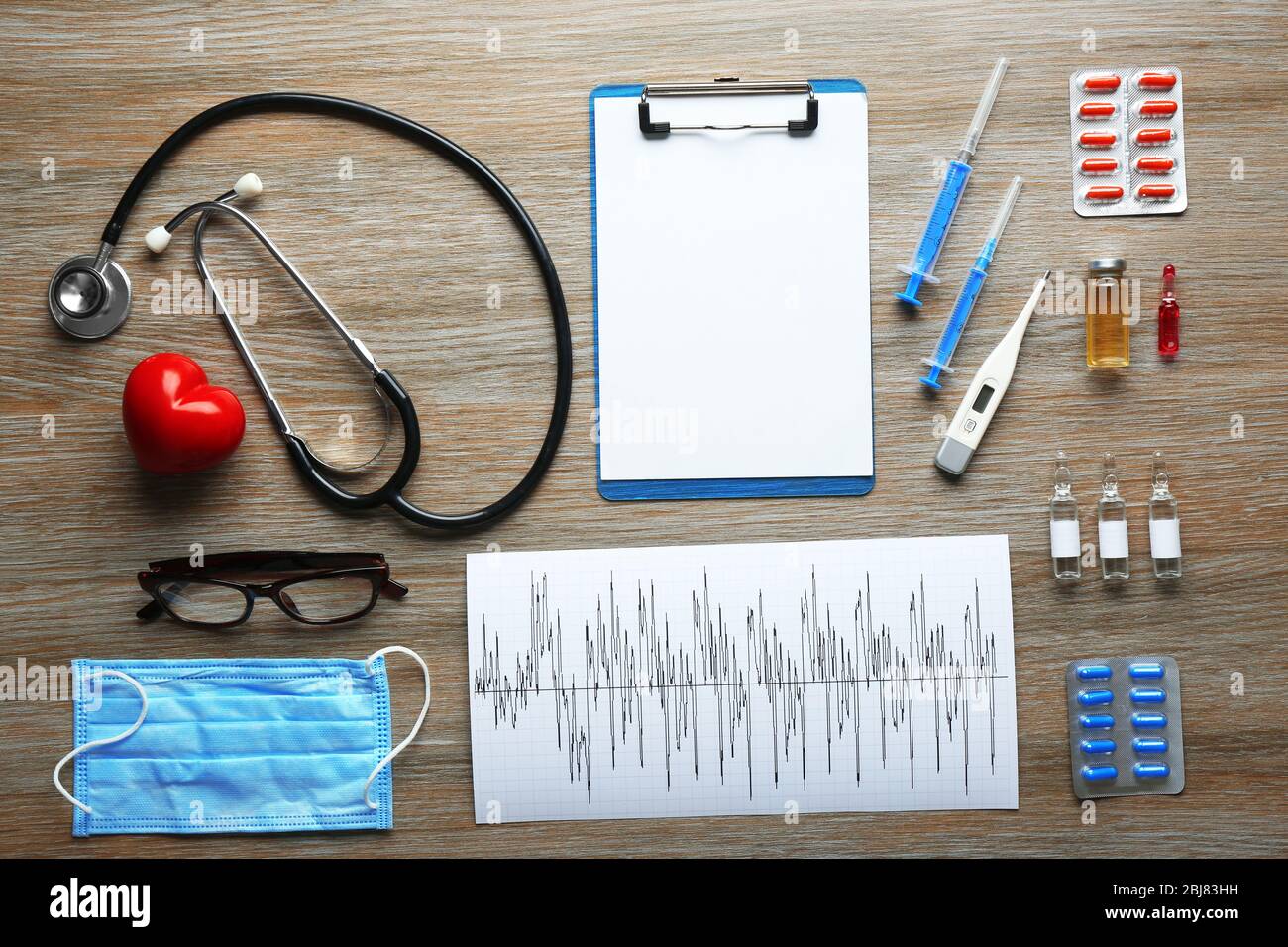 Doctor table with medical items and medicines, top view Stock Photo - Alamy