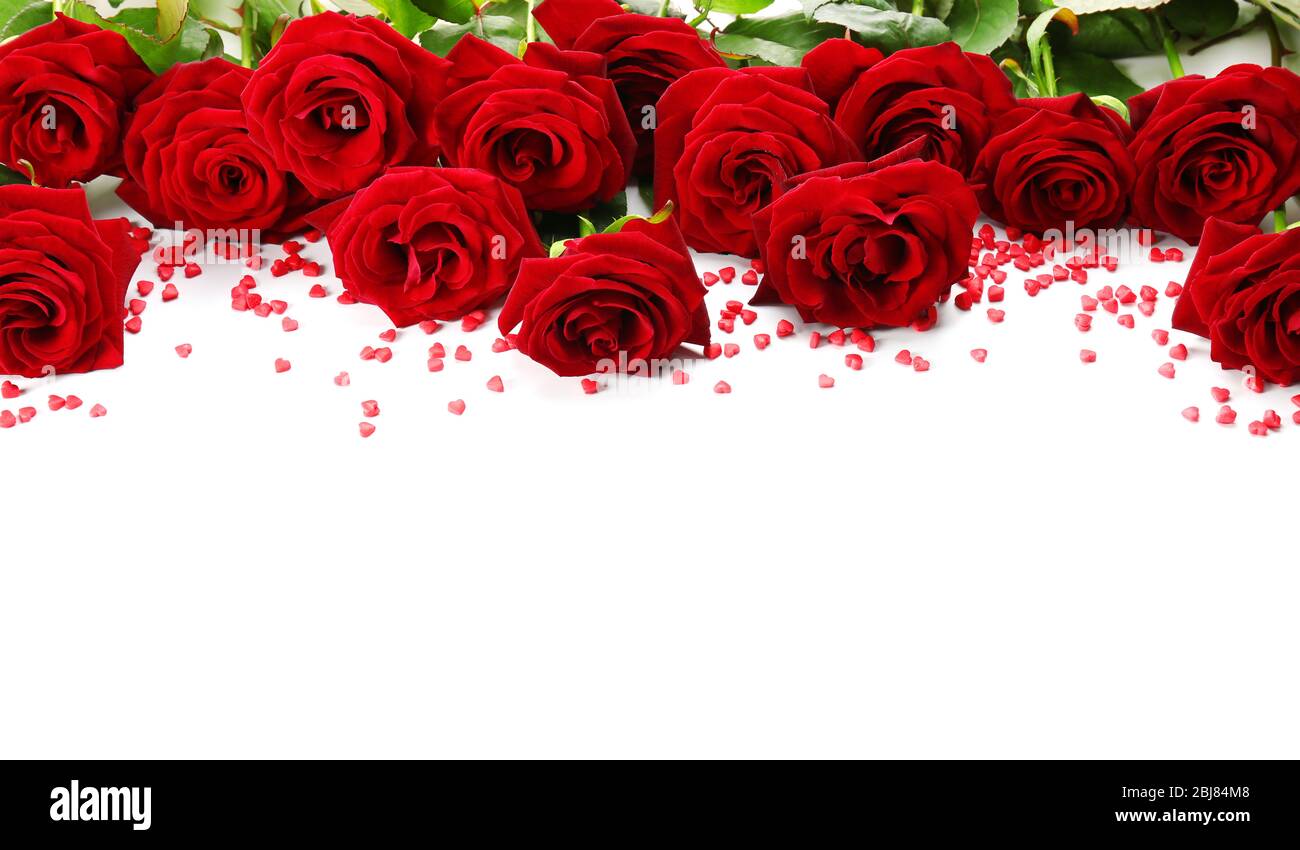 Bouquet of red roses with small hearts isolated on white Stock Photo