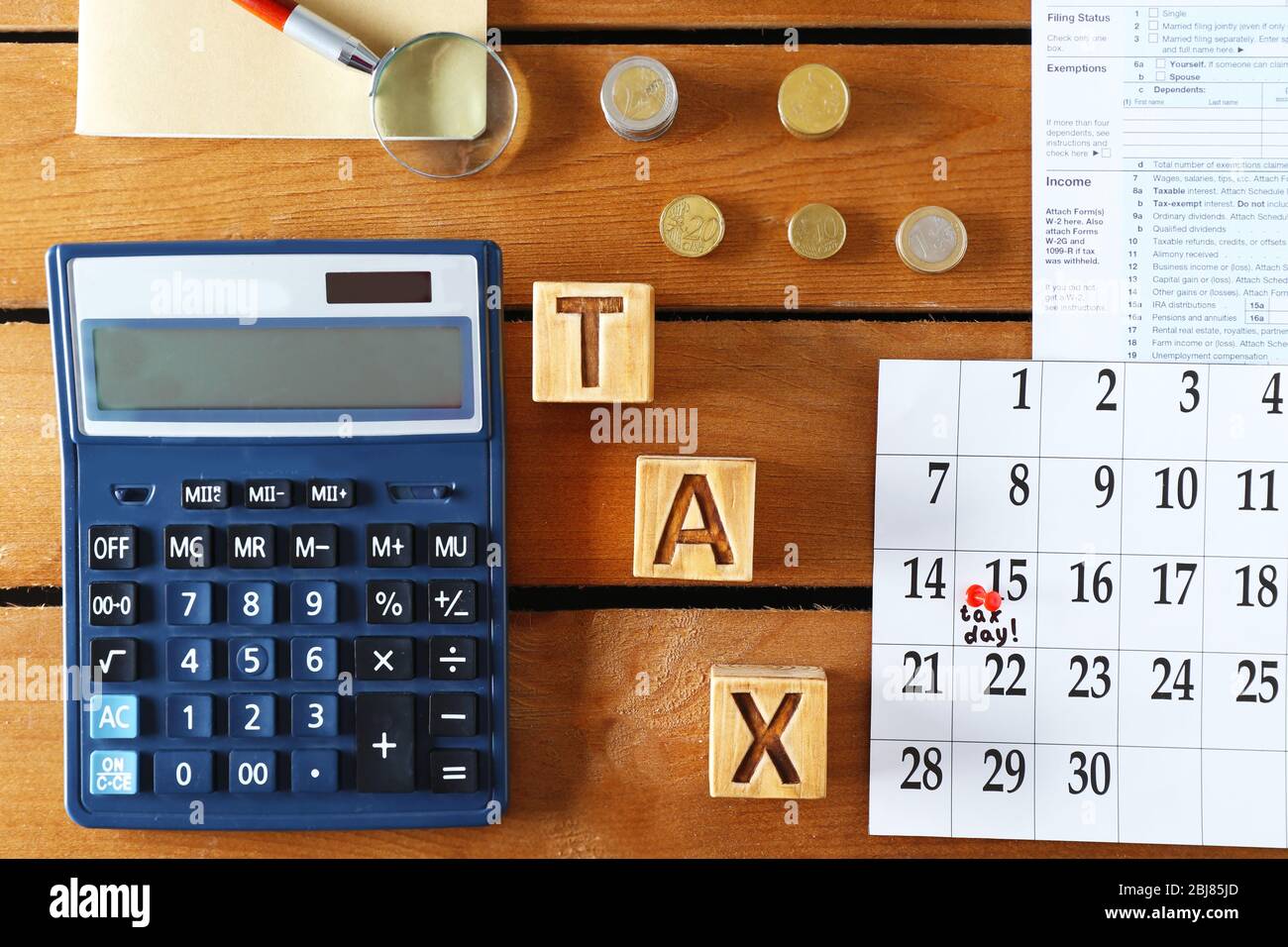 Individual income tax return, calculator and notebook on wooden background  Stock Photo - Alamy