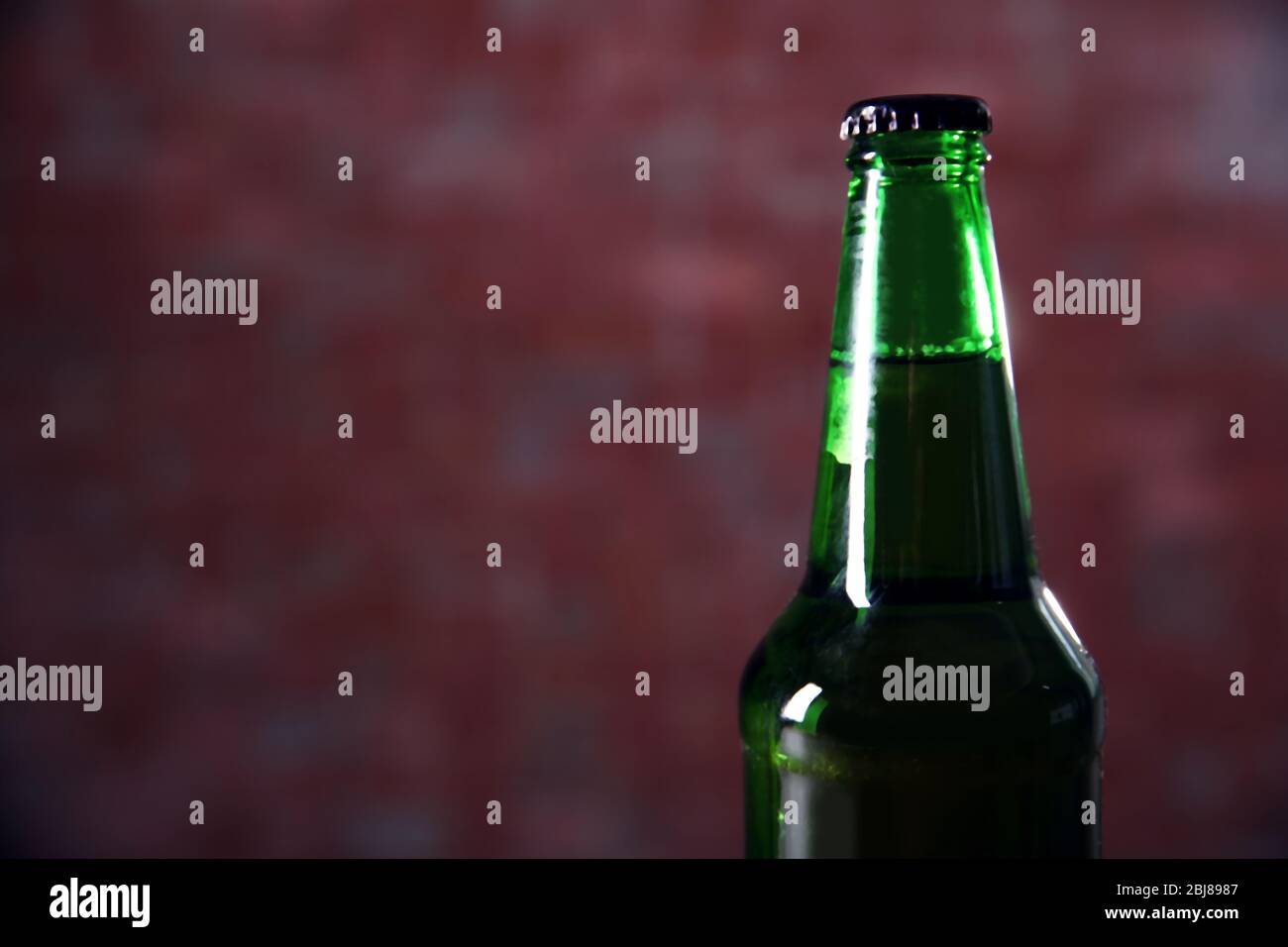 Download Green Glass Bottle Of Beer On Blurred Background Close Up Stock Photo Alamy Yellowimages Mockups