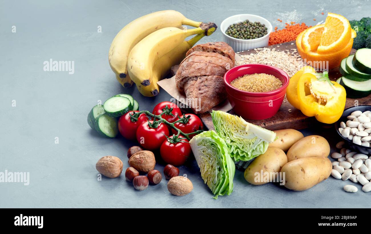 Foods high in carbohydrates on grey background. Vegan Foods high in