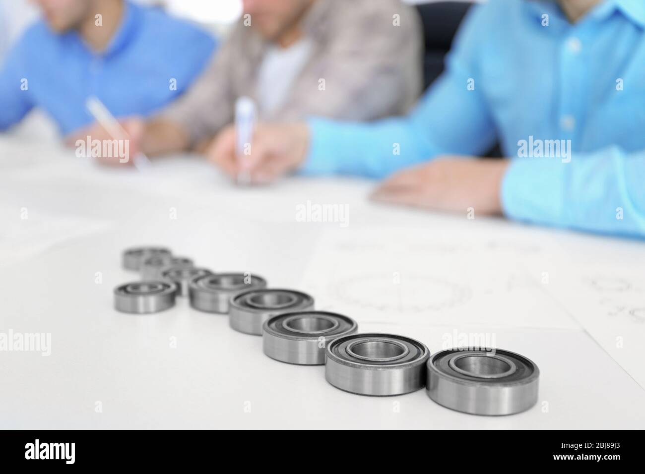 Engineers and bearings on table, closeup Stock Photo