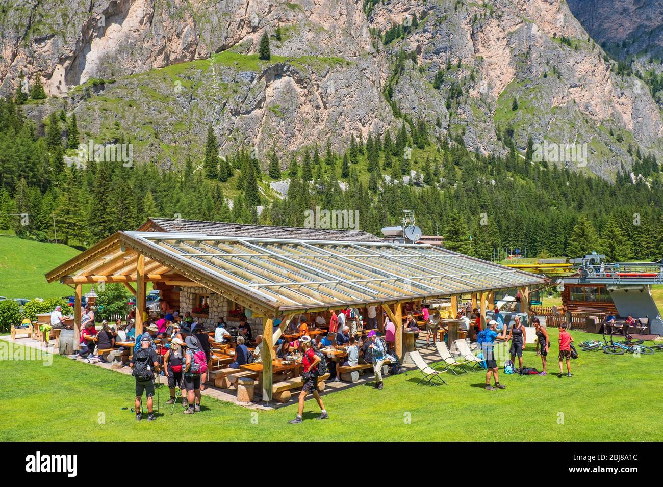 Restaurant with lots of people in an alp valley Stock Photo