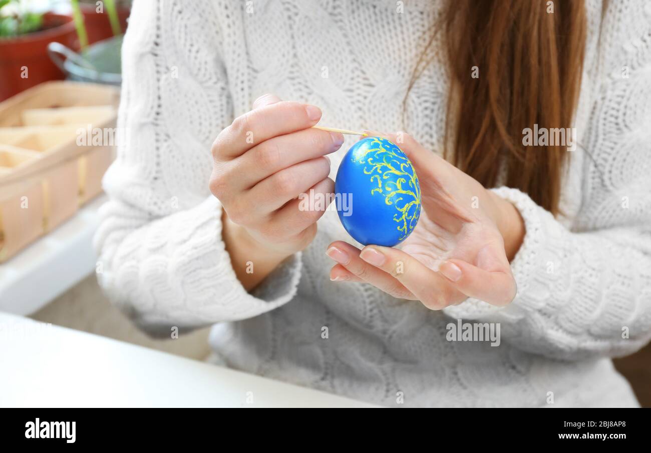 Female hands holding painting egg hi-res stock photography and images ...