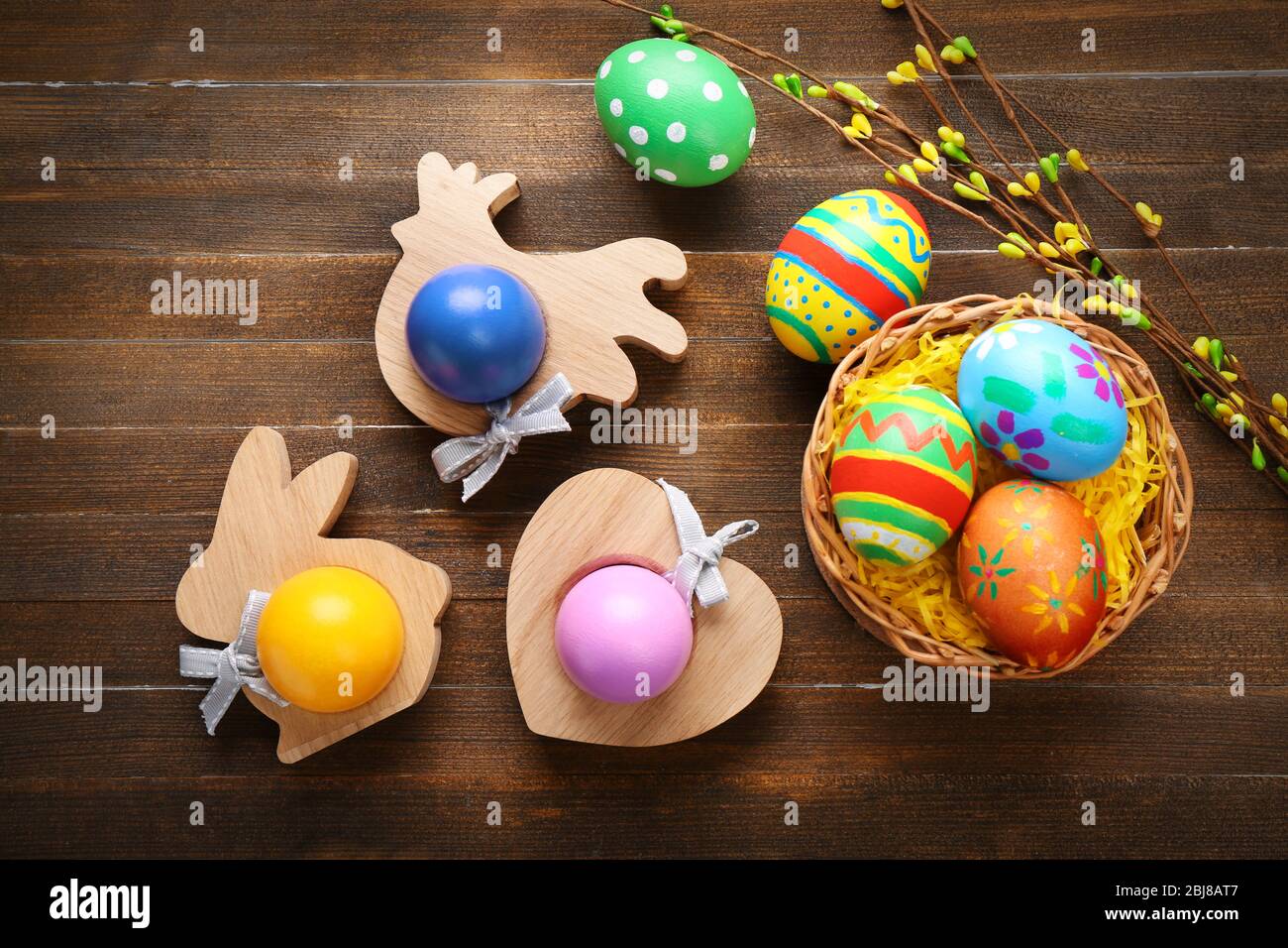 Colorful Easter eggs on wooden background Stock Photo - Alamy